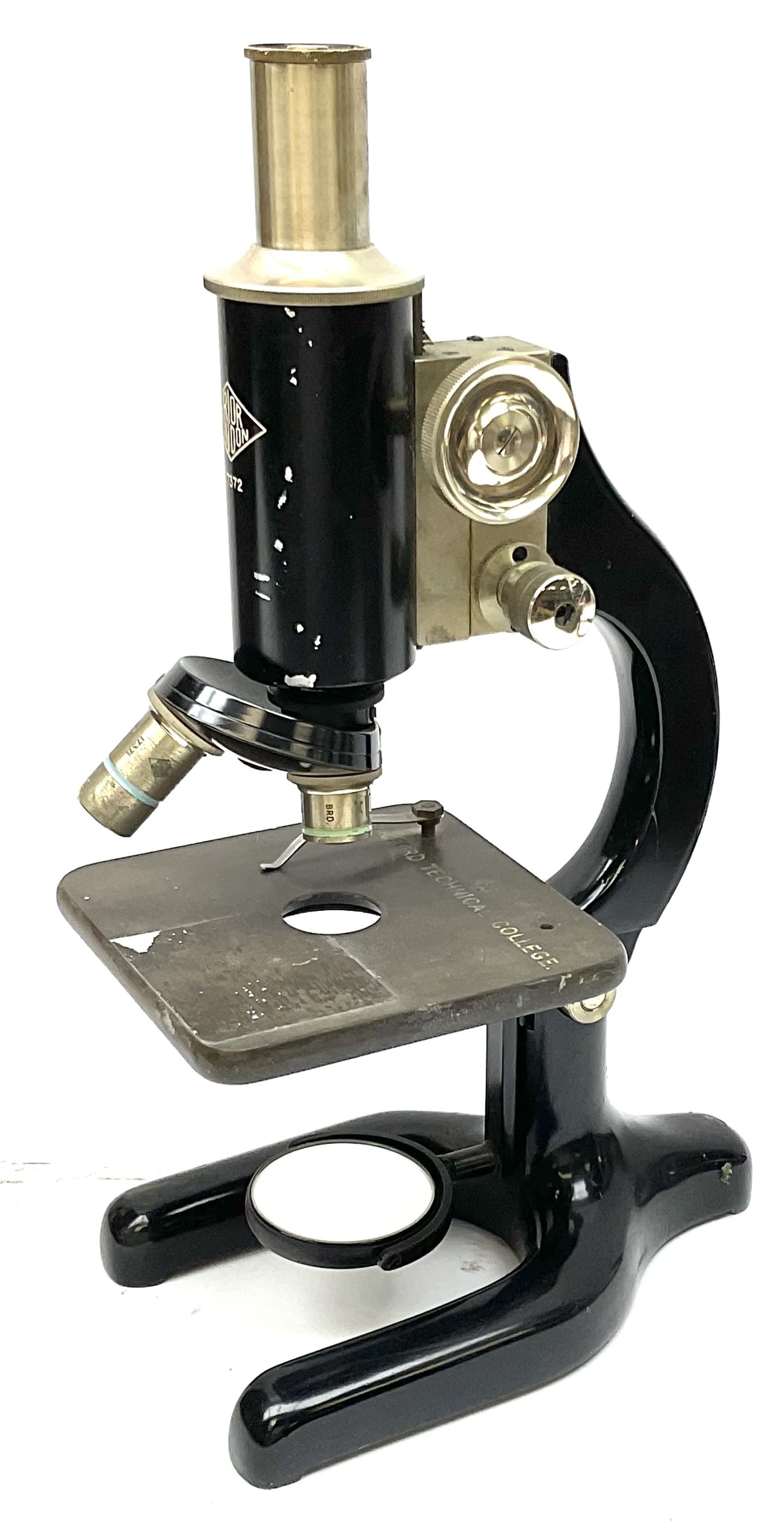 Black finished monocular microscope by Prior London No. 17372,  with pitchfork base and rack and pinion focusing, in original fitted wooden case with additional lenses, H32cm, together with Watts dumpy level, no. 116249, in a leather case