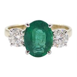 18ct gold three stone oval emerald and round brilliant cut diamond ring, hallmarked, emerald approx 1.70 carat, total diamond weight approx 0.80 carat