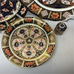 Royal Crown Derby Imari pattern single handled vase, circa 1897, together with two 1126 Imari pattern plates and a saucers, 2451 imari pattern plate and 6299 Imari pattern miniature jar, all with printed marks beneath 
