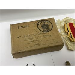 WWII group of three medals comprising 1939-45 War Medal and Italy and Africa Stars in issue box; dog tags for 282894 W. Wilkinson with framed photograph in uniform; and small quantity of cloth and metal badges including RAOC cap badge