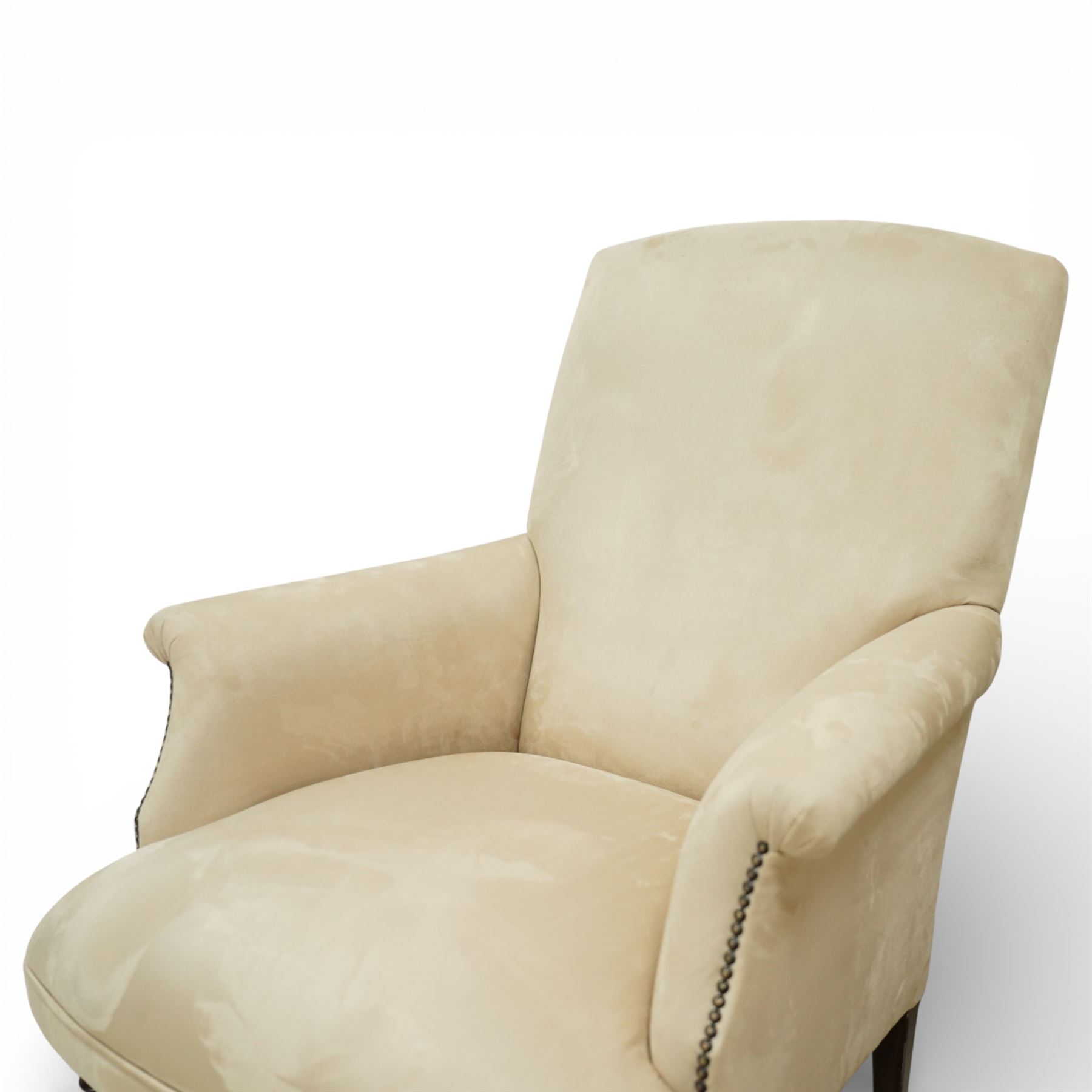 Sofas & Stuff - pair of ‘Thistle’ armchairs upholstered in neutral fabric, each with gently sloping back, padded scroll arms with close-set stud detailing, loose seat cushions, raised on turned wooden legs with brass castors