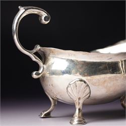 Silver vase shape sugar caster H15cm London 1975 Maker C J Vander Ltd and a George III silver sauce boat with crimped rim and 'C' scroll handle London 1763 Maker possibly William Skeen
