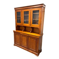 Multi-York -  Loire cherry wood dresser, shaped cornice over three glazed doors enclosing six shelves, the lower section fitted with three shallow drawers with shaped fronts over three cupboards with panelled doors, raised on plinth base with bracket feet
