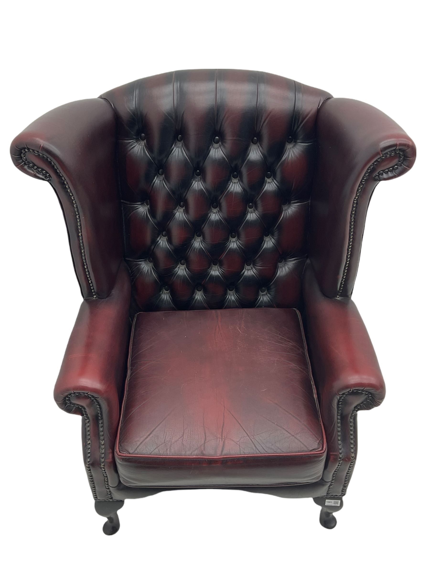 Thomas Lloyd - Georgian style wing back armchair, upholstered in buttoned oxblood leather