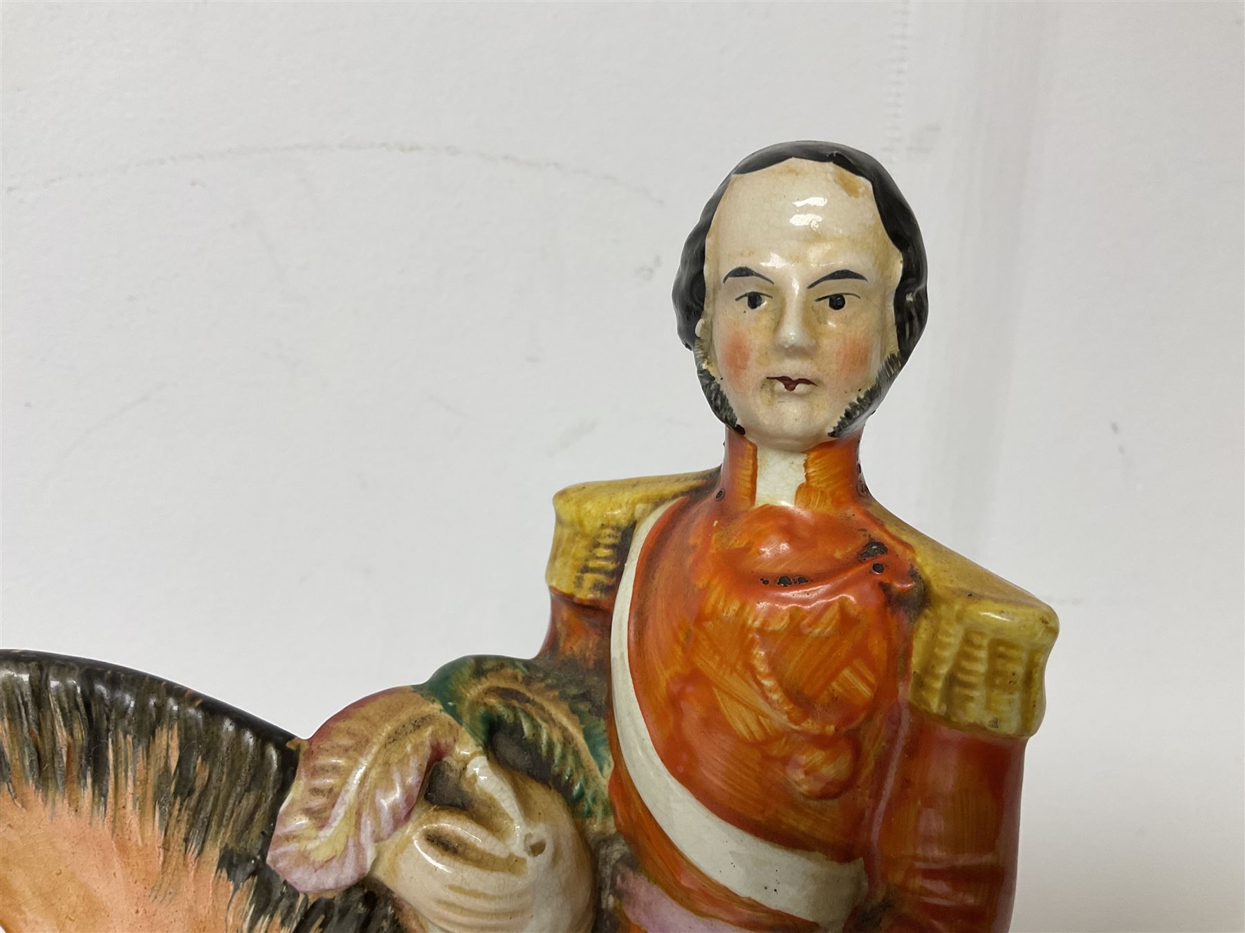 Staffordshire figure of the Duke of Wellington on a bay horse, H30cm in red uniform, together with a similar Staffordshire figure of Dick Turpin, pair of Staffordshire style dogs, H27cm, three Meissen style double salts and two trinket boxes 