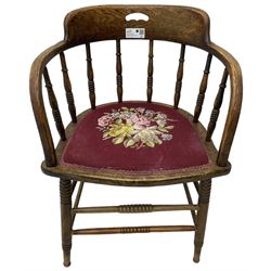 Early 20th century American oak smokers bow tub armchair, shaped cresting rail with pierced handle over ring turned spindle back, seat upholstered in pink tapestry fabric (W56cm, H73cm); small 20th century walnut occasional table on turned supports (W43cm, H70cm, D33cm)