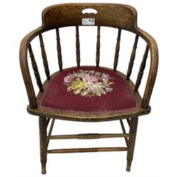 Early 20th century American oak smokers bow tub armchair, shaped cresting rail with pierced handle over ring turned spindle back, seat upholstered in pink tapestry fabric (W56cm, H73cm); small 20th century walnut occasional table on turned supports (W43cm, H70cm, D33cm)
