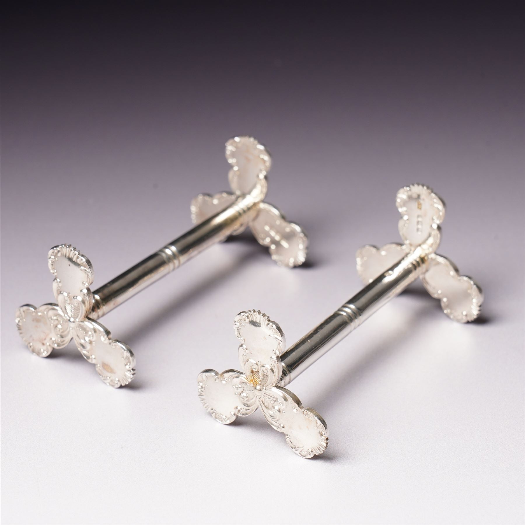 Pair of late Victorian silver knife rests with scroll moulded decoration Sheffield 1898 Maker Lee & Wigfull in original leather box for A & J Thompson, Scarborough 