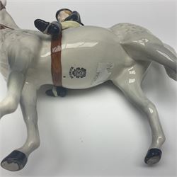 Beswick hunting group, comprising huntswoman on grey horse no 1730, huntsman on brown horse no 1501, fox figure no 1440 and eight fox hounds, all with printed marks beneath (11)