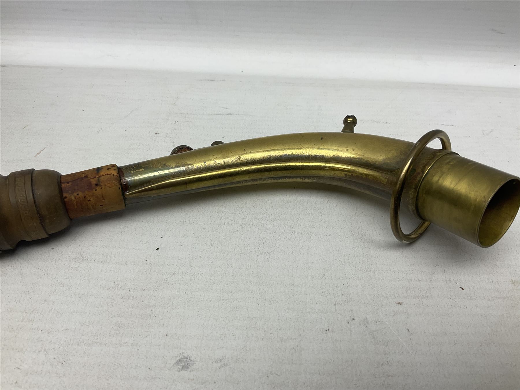 Lacquered brass 'King' alto saxophone inscribed Made by the H.N. White Co.' (Cleveland Ohio) with crook, serial no.84128; also stamped No.1 549 911 and Pat D 8-18-25; in fitted carrying case 