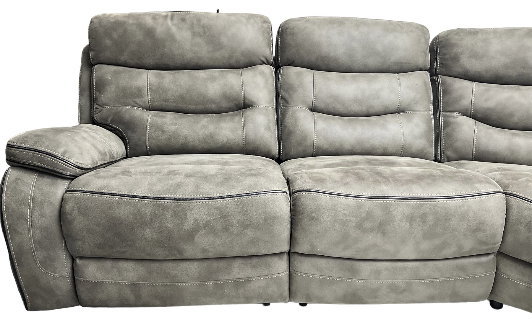 Large contemporary reclining corner sofa, upholstered in gunmetal grey faux suede fabric with black piping