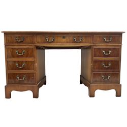 Georgian design yew wood twin pedestal office desk, rectangular top with inset green leather writing surface, fitted with nine cock-beaded drawers