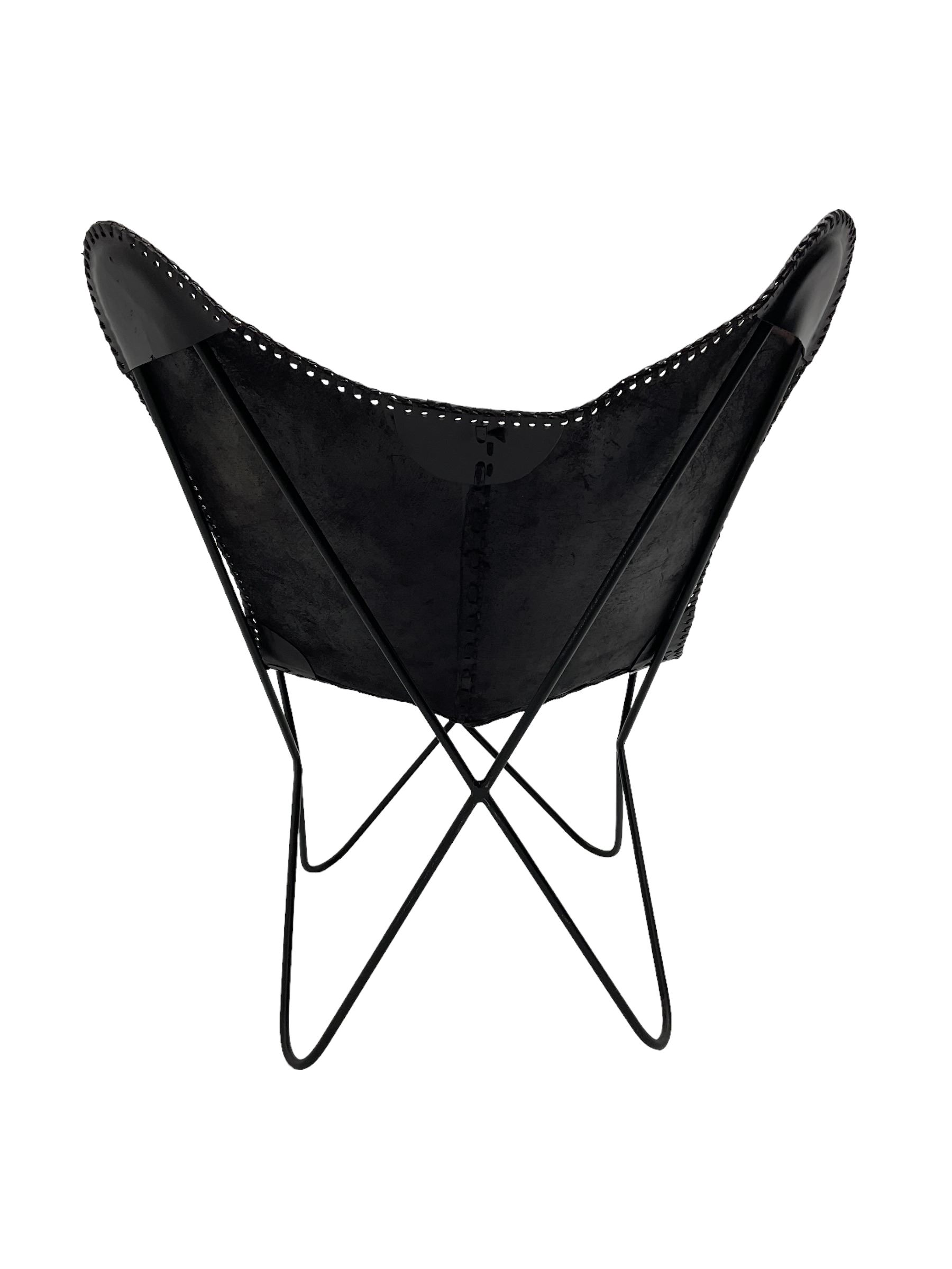 Butterfly Chair, black finish metal frame with stitched slung leather cover