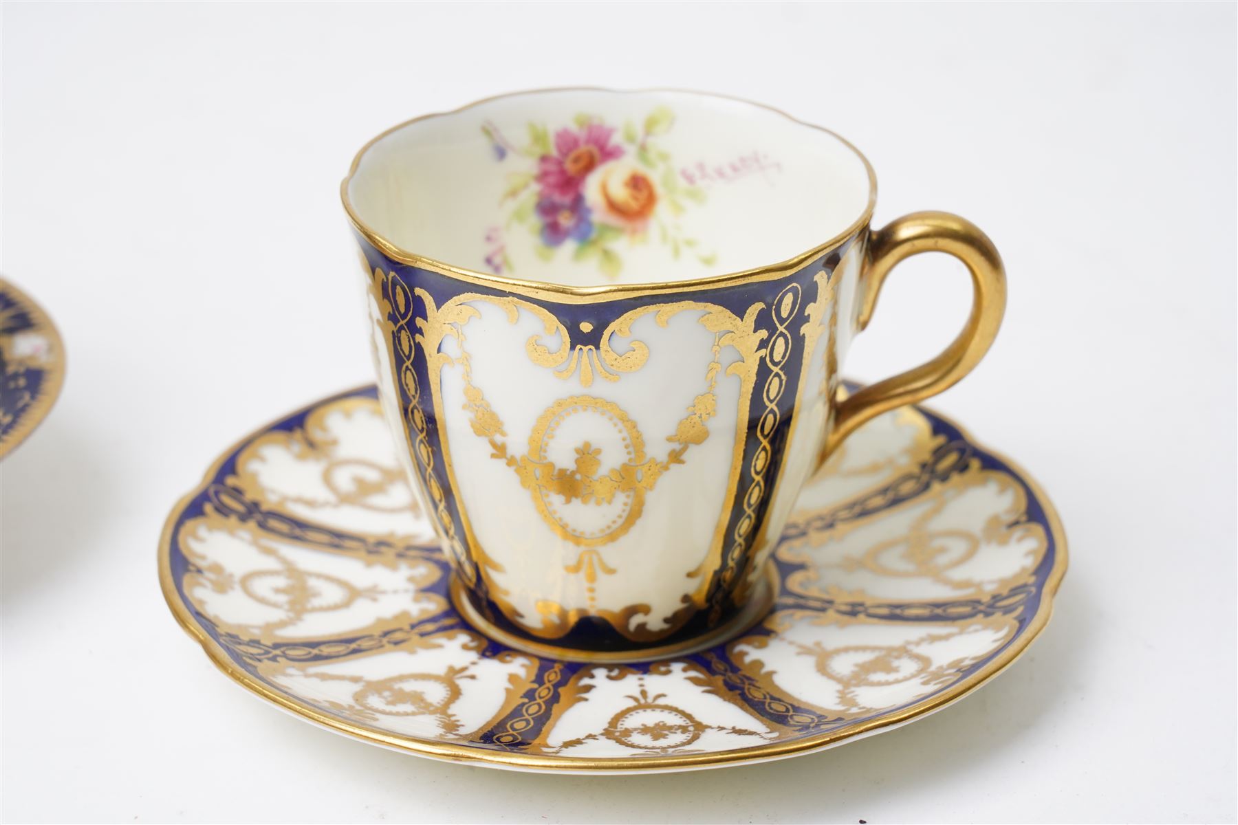 Grainger Lee & Co Worcester teacup, together with a collection of cobalt blue cabinet cups and saucers,  including a Royal Doulton hand-painted example by E Percy, and various others 19th century and later, mostly unmarked (7 pairs)