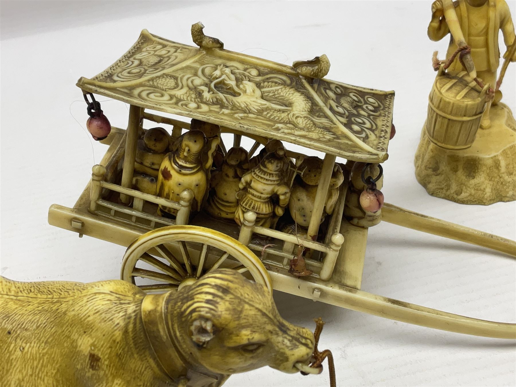 Collection of Japanese celluloid figures, including Rickshaw groups, fishing scene, oxen etc 