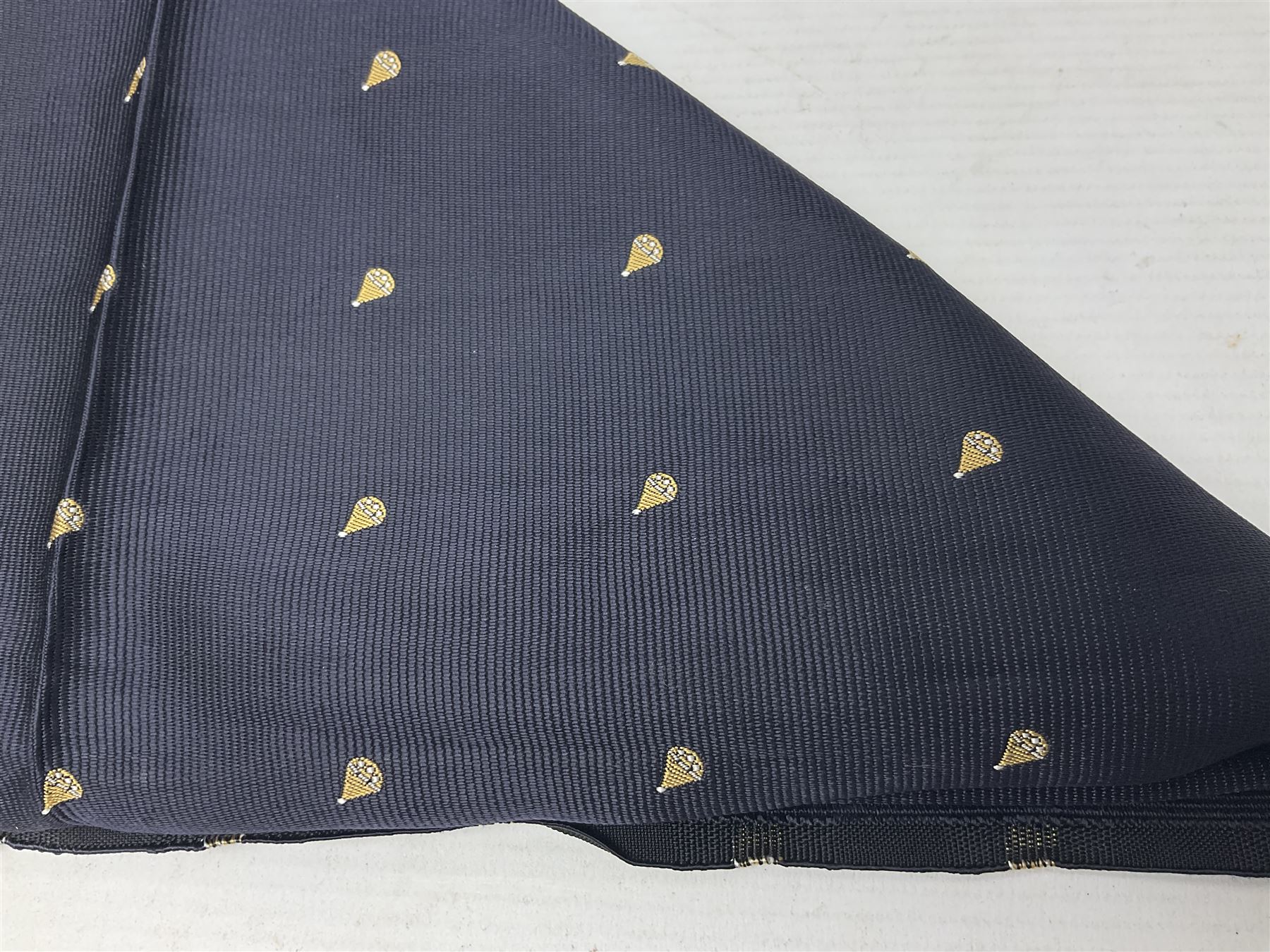British SOE scarf/cravat woven with rows of small parachutes on a navy blue ground 74 x 76cm