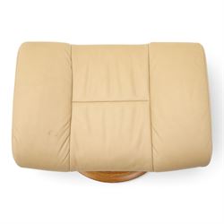 Ekornes Stressless - beech framed reclining swivel armchair with matching footstool, on U-shaped supports with circular bases, upholstered in beige leather