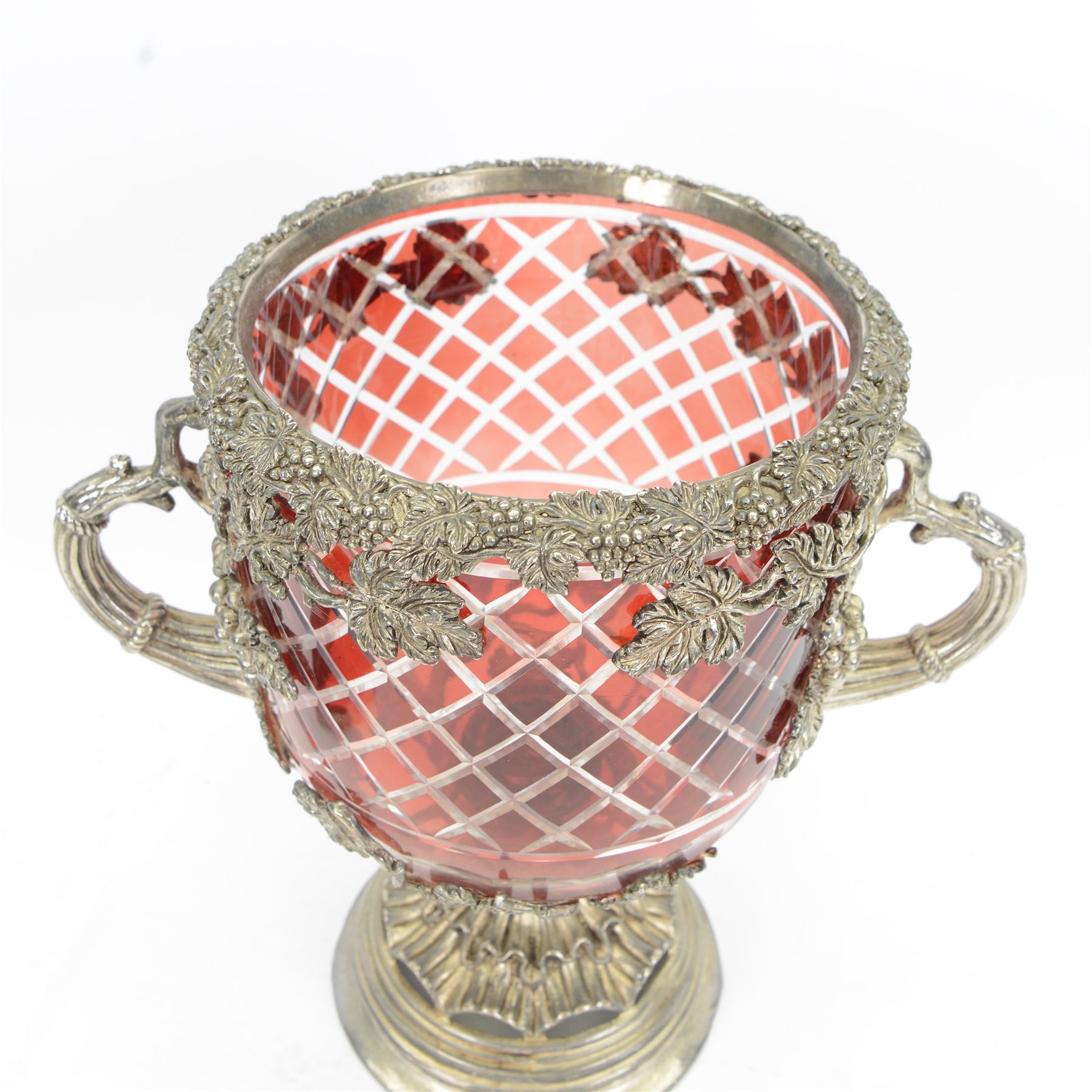 19th century silver plated and ruby glass wine cooler, of urn form, the cut ruby glass bowl with silver plated fruiting vine mount and twin vine handles, upon a spreading frilled stem and circular stepped foot, H33cm
