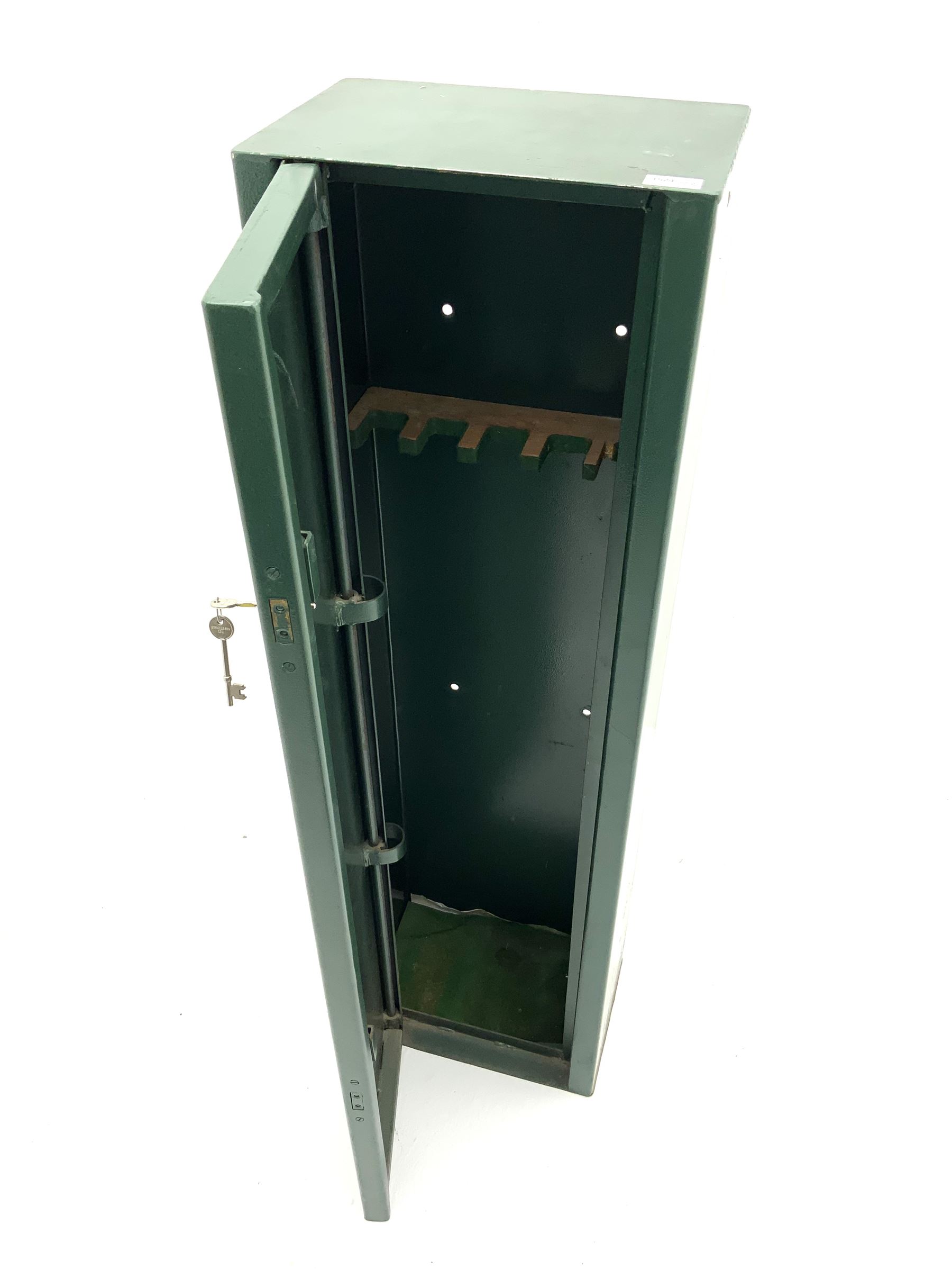 Green metal gun cabinet with keys 