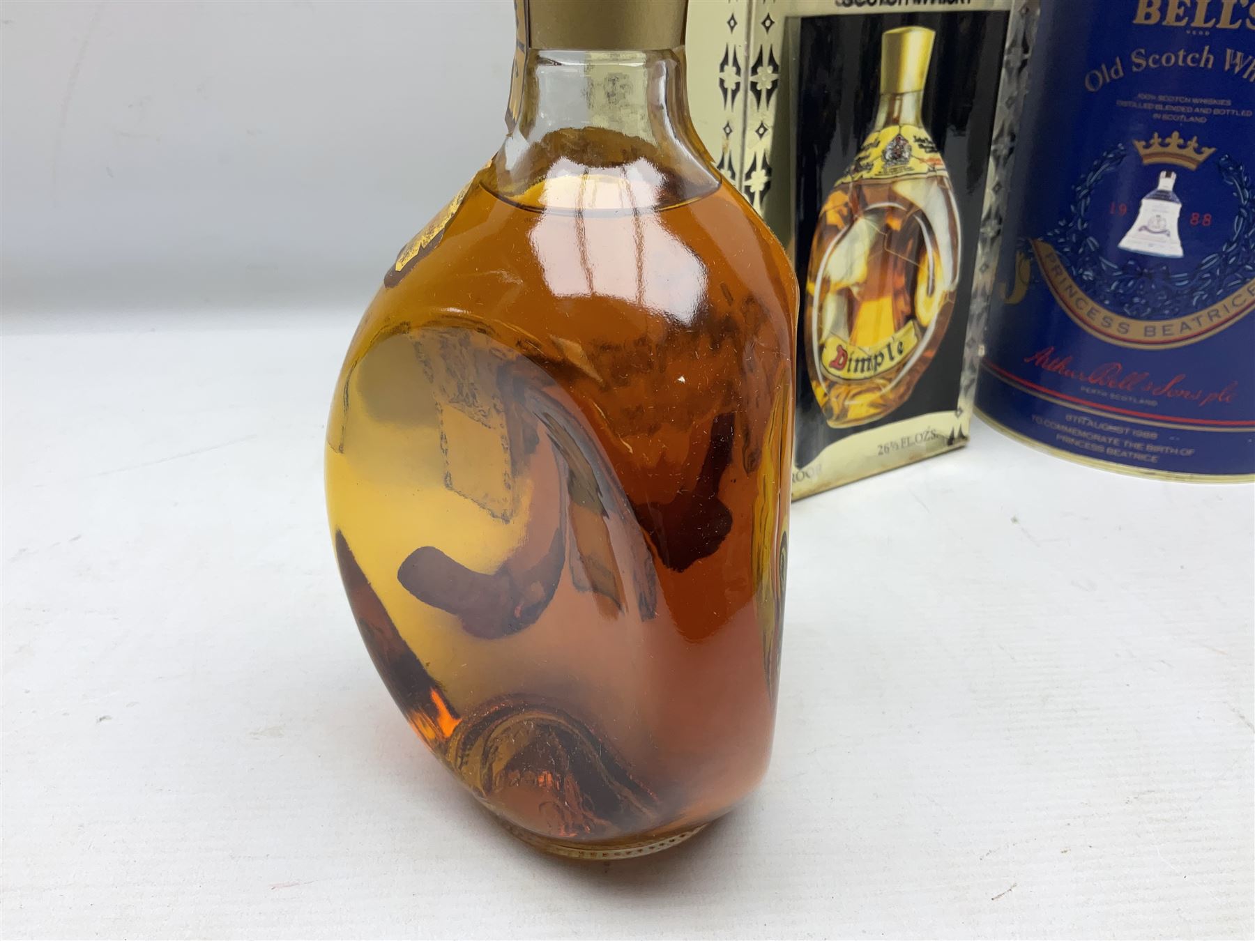 John Haig & Co Dimple Scotch whisky, 26 2/3 fl oz, 70% proof, one bottle and Bells Princess Beatrice whisky in original box, 75cl, 43% vol, one bottle (2)