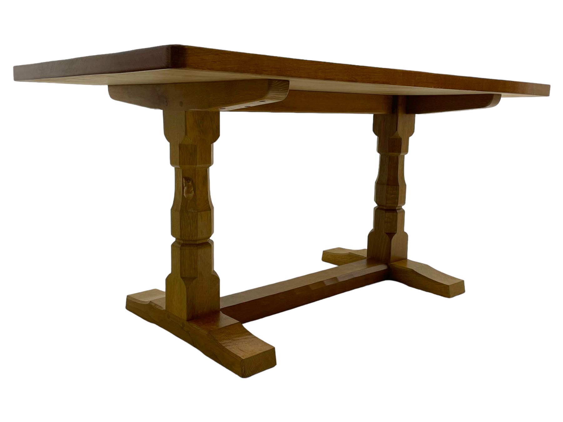 Mouseman - oak dining table, adzed rectangular top on twin octagonal pillar supports, sledge feet united by floor stretcher, by the workshop of Robert Thompson, Kilburn 