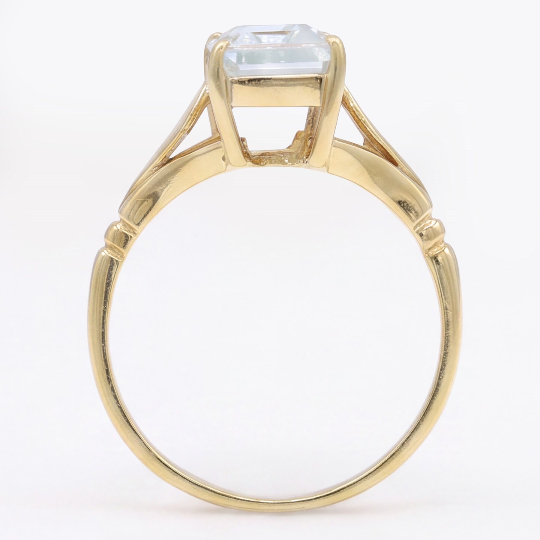 Early - mid 20th century gold aquamarine ring, four claw set with a single emerald cut aquamarine of approx 1.40 carat, stamped 18ct
