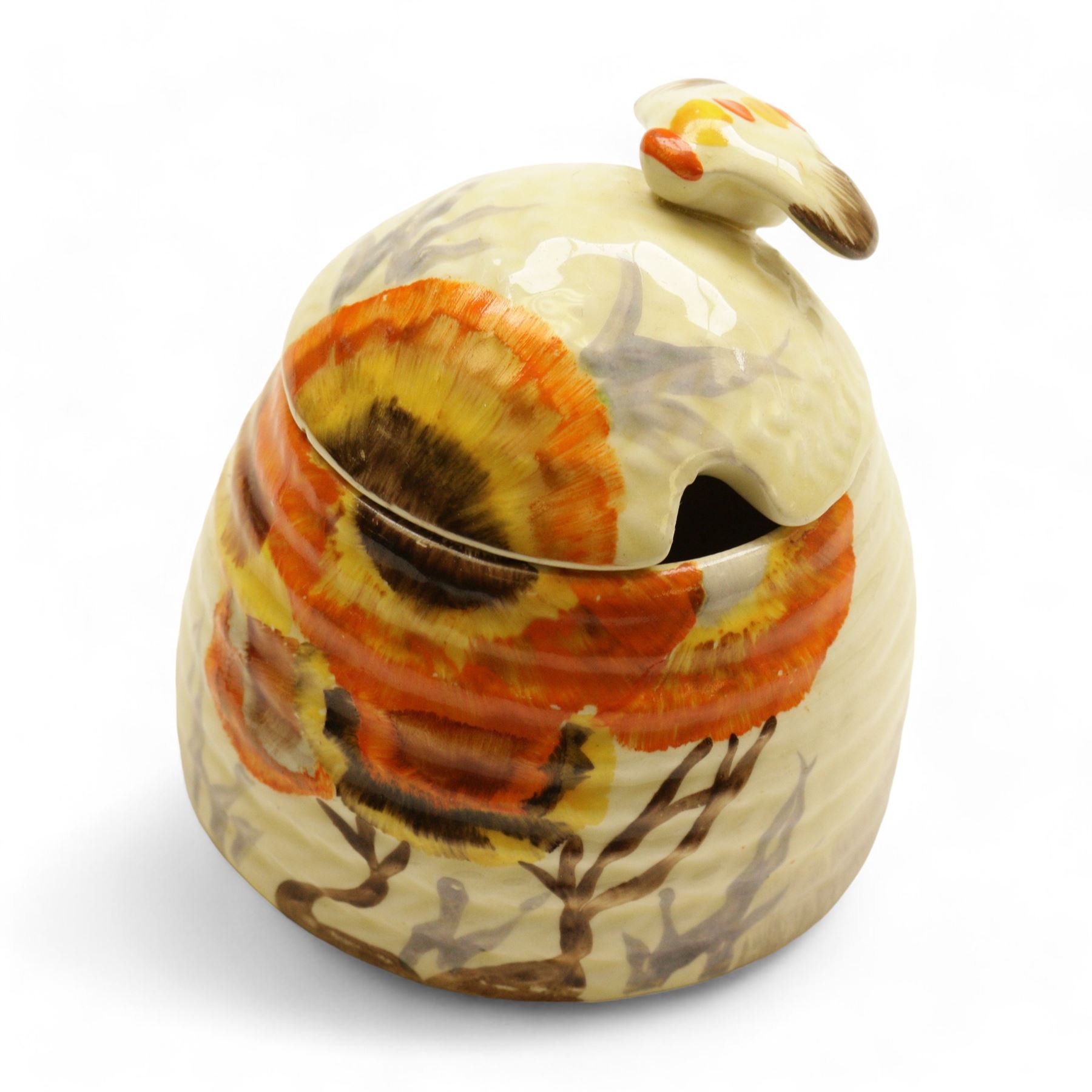 Clarice Cliff Bizarre for Wilkinson Ltd, small beehive honey pot with cover, in Rhodanthe pattern, with printed mark beneath, H7cm