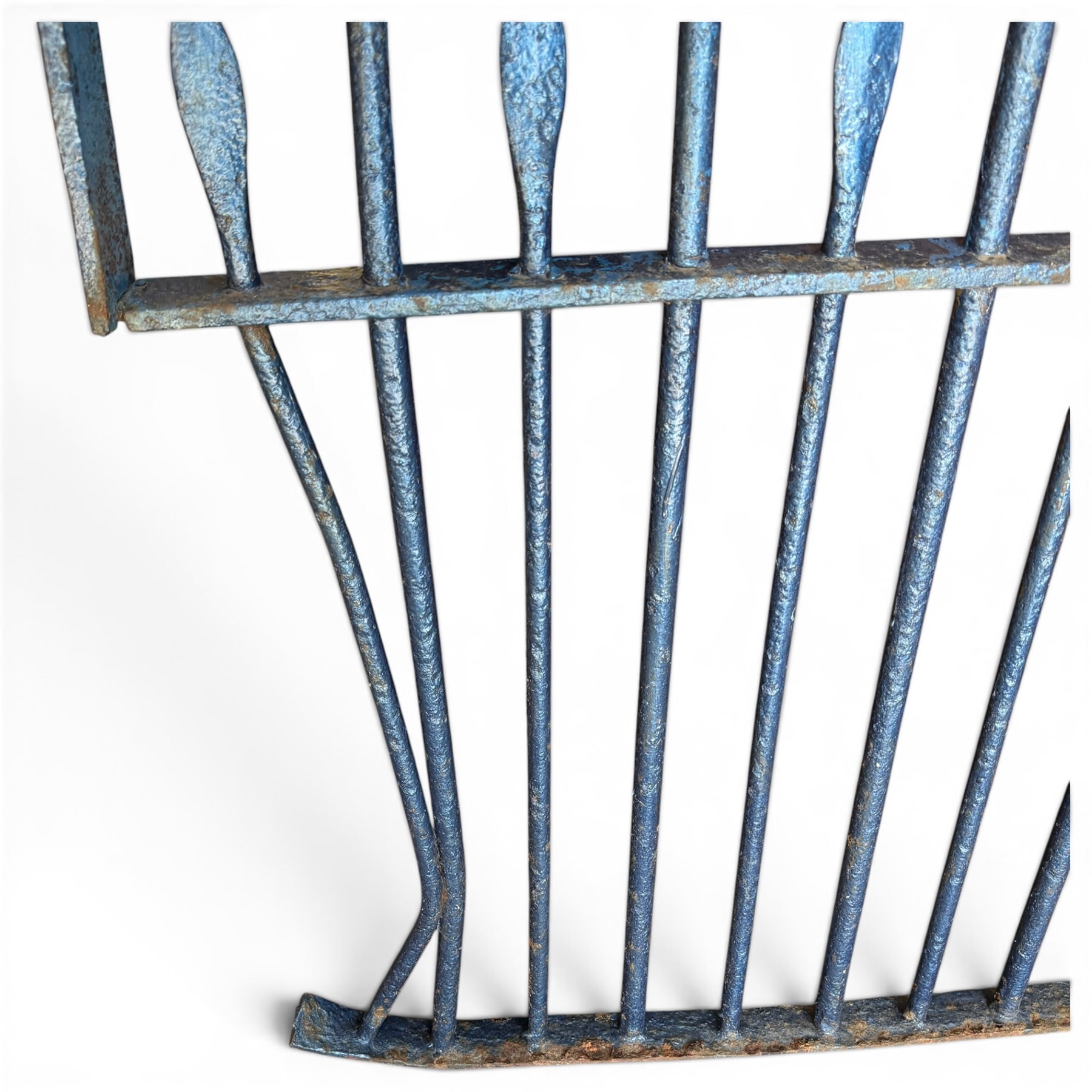 Two sections of painted iron garden or estate boundary railing, comprising a 19th century wrought iron section with graduated spearhead uprights, together with a later hoop-top section with ball-finial end posts, both in blue painted finish