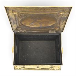 Art Nouveau brass coal box, the hinged rectangular cover embossed with a foliate design, hammered panelled sides with shaped carrying handles, on projecting plinth base with applied roundels
