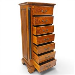 Neoclassical design cherry wood tall pedestal chest, fitted with seven drawers with swan neck handles, flanked by ebonised pilasters with composite capitals, fielded panelled sides on bracket feet