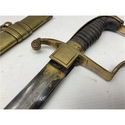 German Saxon 1st Empire Light Cavalry officer's sword c1820s, the 79cm clipped curving blade engraved with the crest of Hanover and various battle trophies with traces of blueing and gilding, brass hilt with knucklebow, foliate square langets, ornate downswept quillon, wire-bound fish skin grip with lion's head pommel; in brass scabbard with two suspension rings L95cm overall