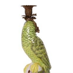 Pair of candlesticks, modelled as green parrot upon a flowering branch, upon four gilt acanthus leaf feet, H36cm