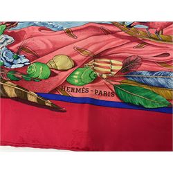 Hermès 'Christophe Colomb Découvre l'Amérique' jacquard silk scarf, designed by Carl de Parcevaux in 1992, limited edition for the bi-centenary of the discovery of America, printed with a central image of Christopher Columbus' ship at sea, surrounded with colourful stylised feathers, birds, flags, globes, shells and flowers, contained within vibrant red border, with rolled hand stitched edges and Hermes material label, 87cm square