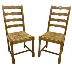 Set of six (4+2) beech dining chairs, high ladder back over drop-in rush seats, on ring turned supports united by H-stretcher