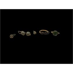 Gold garnet three stone ring, gold green stone set ring and two pairs of gold cubic zirconia earrings