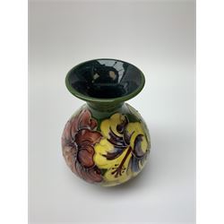 A Moorcroft vase of bulbous form with waisted neck decorated in the hibiscus pattern, with impressed marks beneath, H13cm. 