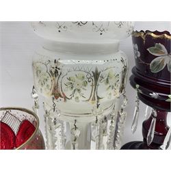 Bohemian red glass lustre, painted with stylised floral and foliate decoration, together with a milk glass example and two bohemian goblets converted to lustres 