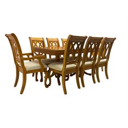 Yew wood extending twin pedestal dining table, rectangular top with ebony stringing over turned and reeded vasiform pedestals on tripod bases, with two additional leaves (W159cm D92cm); and set of eight (6+2) matching dining chairs, high pierced backs over seats upholstered in ivory fabric, on cabriole supports (W57cm H101cm)