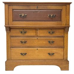 Edwardian oak secretaire or bureau, fall-front enclosing fitted interior over two short and two long drawers, on bracket feet