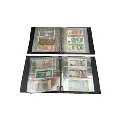 World banknotes, including Queen Elizabeth II The States of Jersey one pound 'DB202703', five pounds 'BB527762' and ten pounds 'AB651481', reserve bank of New Zealand two dollars '1L3 741894', King George V Straits Settlements one dollar 1st January 1935 'F/83 28924', various Bank of England notes etc, housed in two ring binder albums
