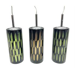 Three contemporary glass pendant lights, the black glass glass cut away revealing green and brown beneath, H24cm