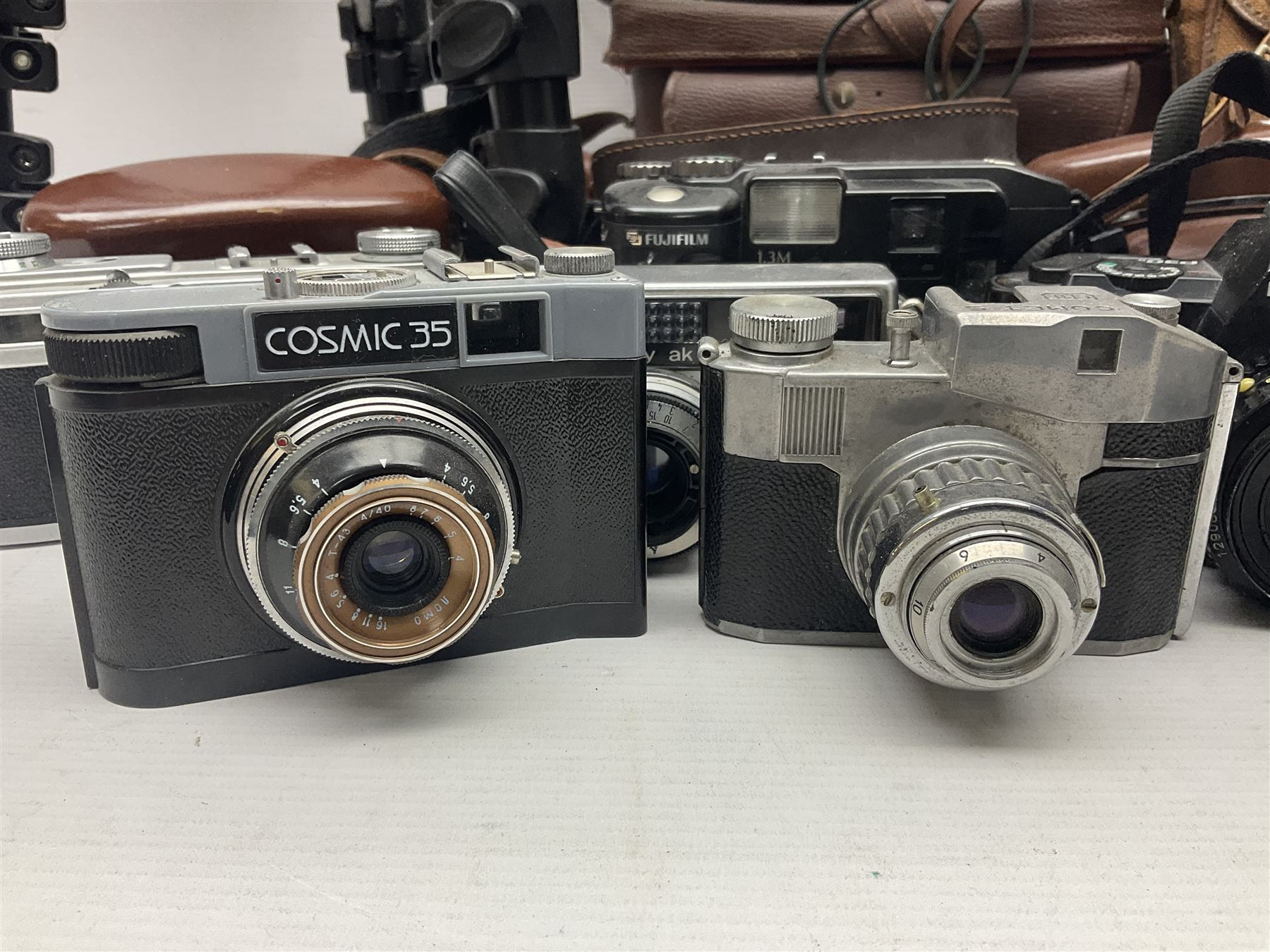 Collection of cameras and lenses, to include Pentax Program A camera body, serial no 123759, with 'Pentax-A zoom 1:3.5-4.5 28-80mm' len, Praktica EE2 camera body with 'Pentacon electric 1.8/50' lens etc, together with a Manfrotto tripod 