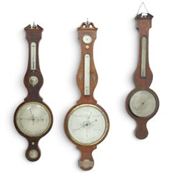 Three mahogany wheel barometers, each with silvered dial, thermometer and hygrometer, two ...