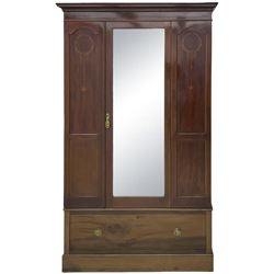 Edwardian inlaid mahogany wardrobe, projecting moulded cornice over central bevelled mirror glazed door, panelled uprights inlaid with trailing bellflowers and foliate decoration, the skirted base fitted with single drawer 
