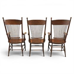 Set of three 19th century ash and elm spindle back Windsor armchairs, arched top rails above fan-shaped spindle backs, curved arms with turned supports, shaped saddle seats, on turned legs joined by H-stretchers