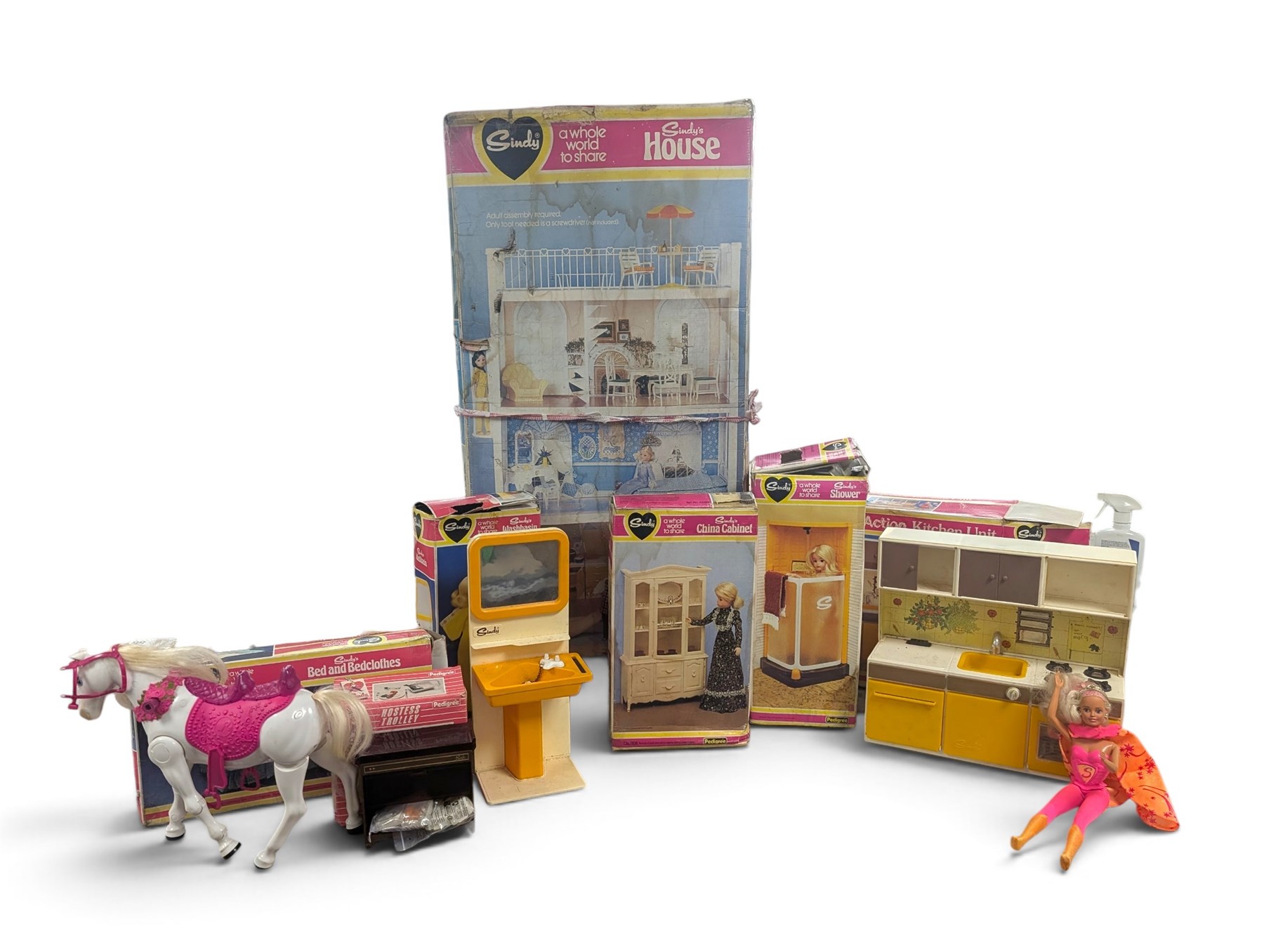 Pedigree Sindy's House and furniture, including shower, kitchen unit, washbasin, china cabinet and bed, all boxed, together with Barbie doll and horse