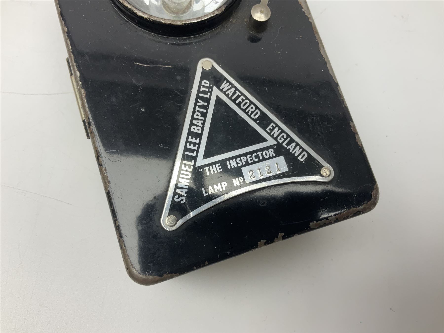 Police - Victorian turned hardwood truncheon with traces of decoration and VR cypher L42cm; Humberside Police helmet with Queens Crown helmet plate; hand lamp inscribed 'The Inspector'; and small pair of pewter figures of police officers (5)