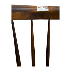 Late 19th century elm and beech Windsor rocking chair, with shaped top rail over turned spindles and curved arms, circular seat raised on turned legs united by stretcher on rockers