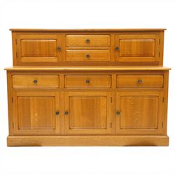 Knightman - Yorkshire oak dresser, the upper section fitted with two drawers flanked by two hutch cupboards, rectangular top over three drawers and fielded panelled cupboard, on skirted base, carved with knight signature, by Horcace Knight of Thirsk