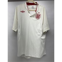 Fourteen items of replica sporting clothing including Leeds United football club shirts, England jerseys etc
